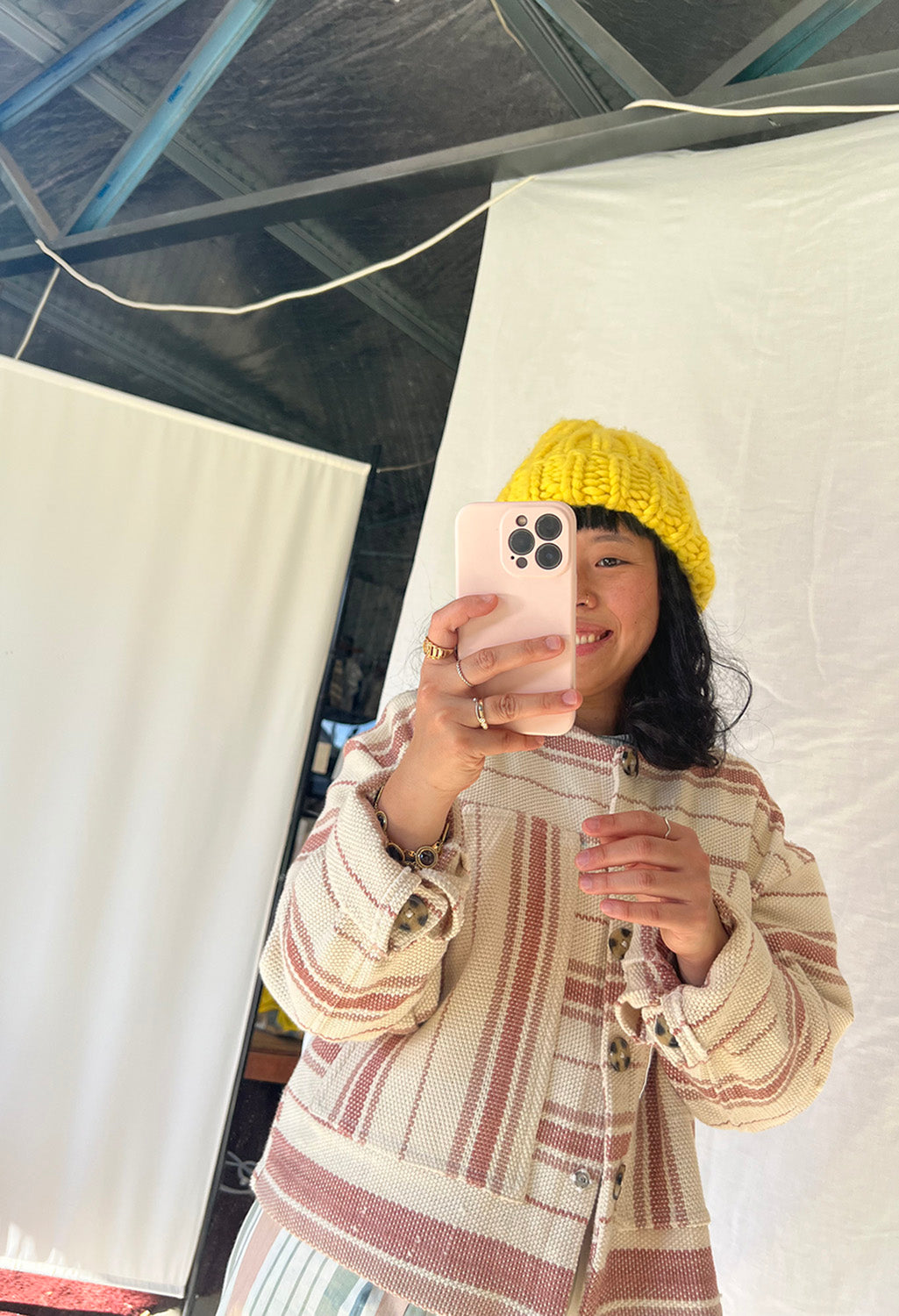 pink striped cotton handwoven jacket worn by a person doing a selfie