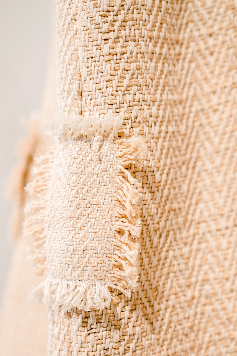Close-up of woven cotton fabric showing softened fibres and natural texture developed through wear