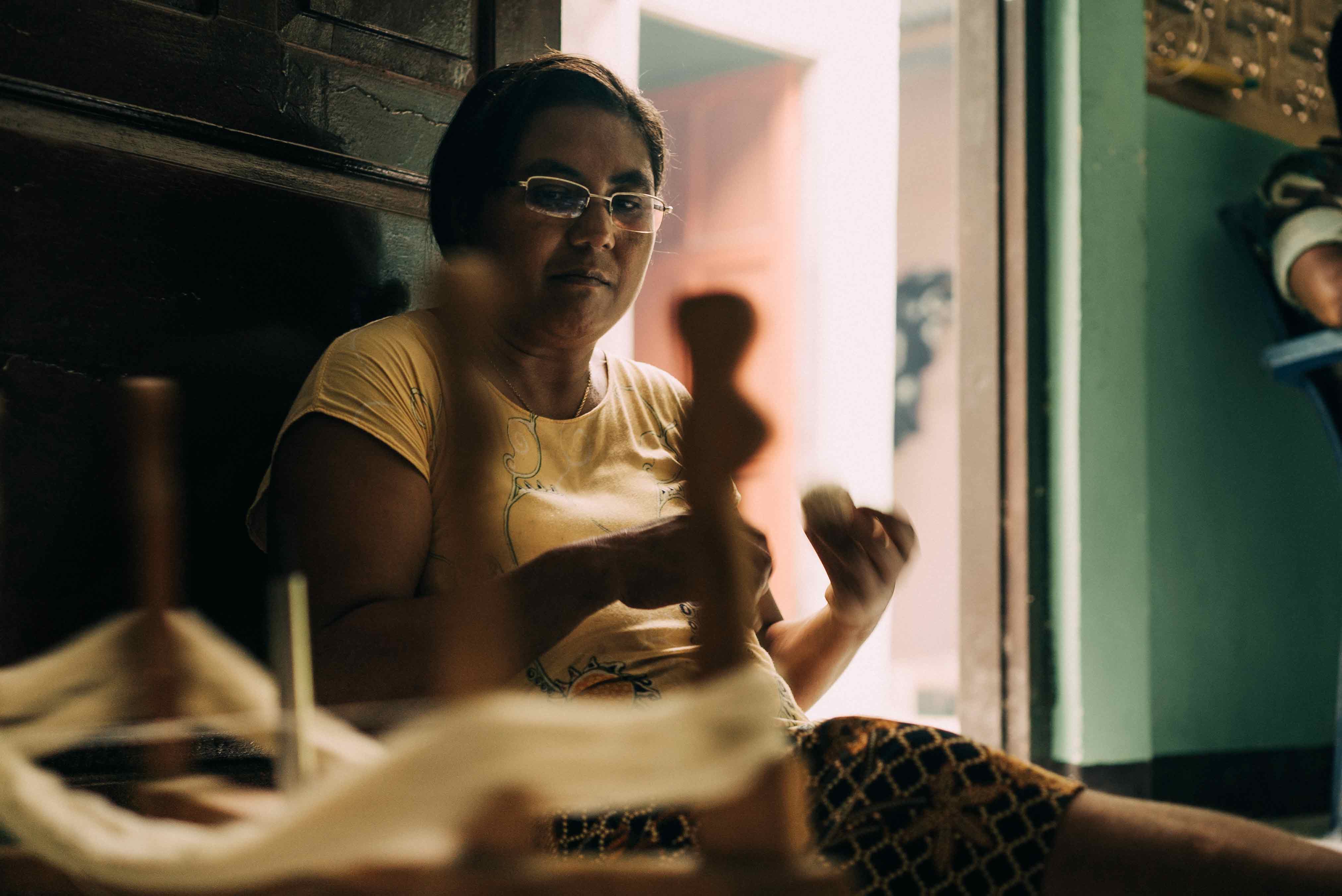 Artisan working with traditional tools as part of a steady, capacity-led production process guided by human rhythm and natural limits.