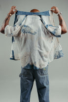 handpainted cotton batik shirt with natural and indigo strokes photographed from the back